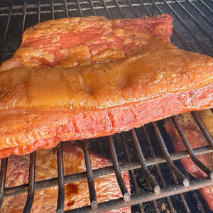 juicy bacon being smoked