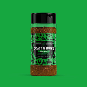 A spice shaker containing a rustic Jerk seasoning on a green background with a green label The label has cooking and surfing icons all over.