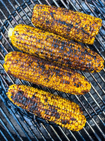 Succulent charred corn on the barbecue