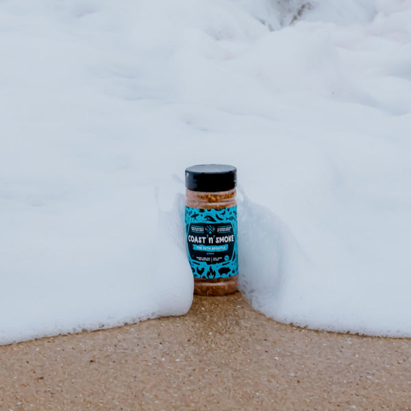 Gyros seasoning jar in breaking surf waves