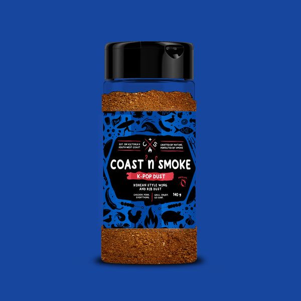 Coast n Smoke K-Pop Dust seasoning jar on a blue background