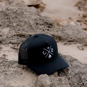 coast n smoke baseball cap on the beach