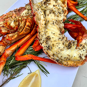 Halved crayfish cooked with butter and salt, pepper, garlic blend