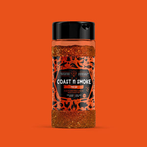 a jar of sweet and heat bbq seasoning on an organ background matching it's orange label