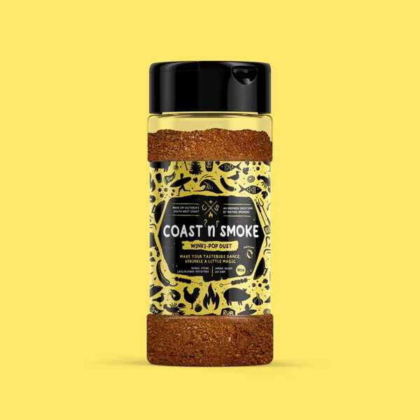 Cajun magic seasoning on yellow background with a yellow label with surfy and bbq icons