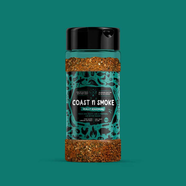 A montreal steak seasoning on a peacock green background